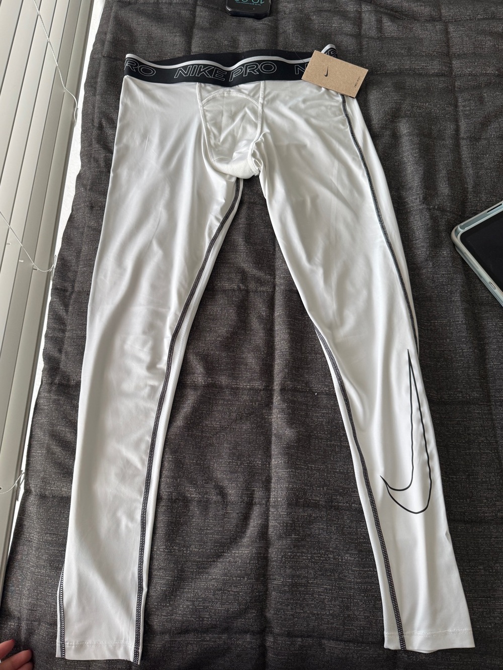 Nike White Compression Leggings with Black Waistband and Swoosh Detail